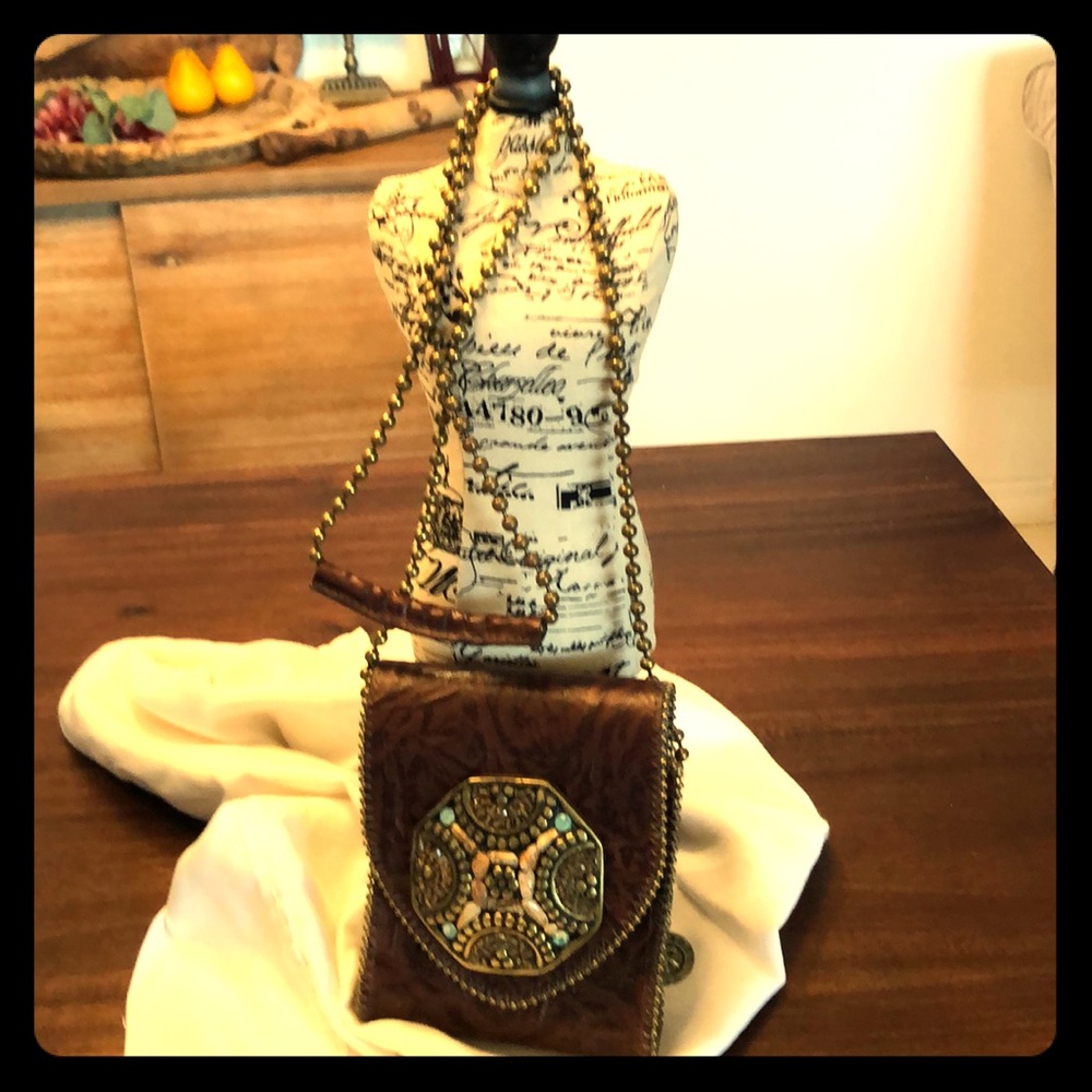 Leather bag with stone buckle.